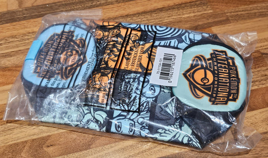 Packaged socks with branding on a wooden surface