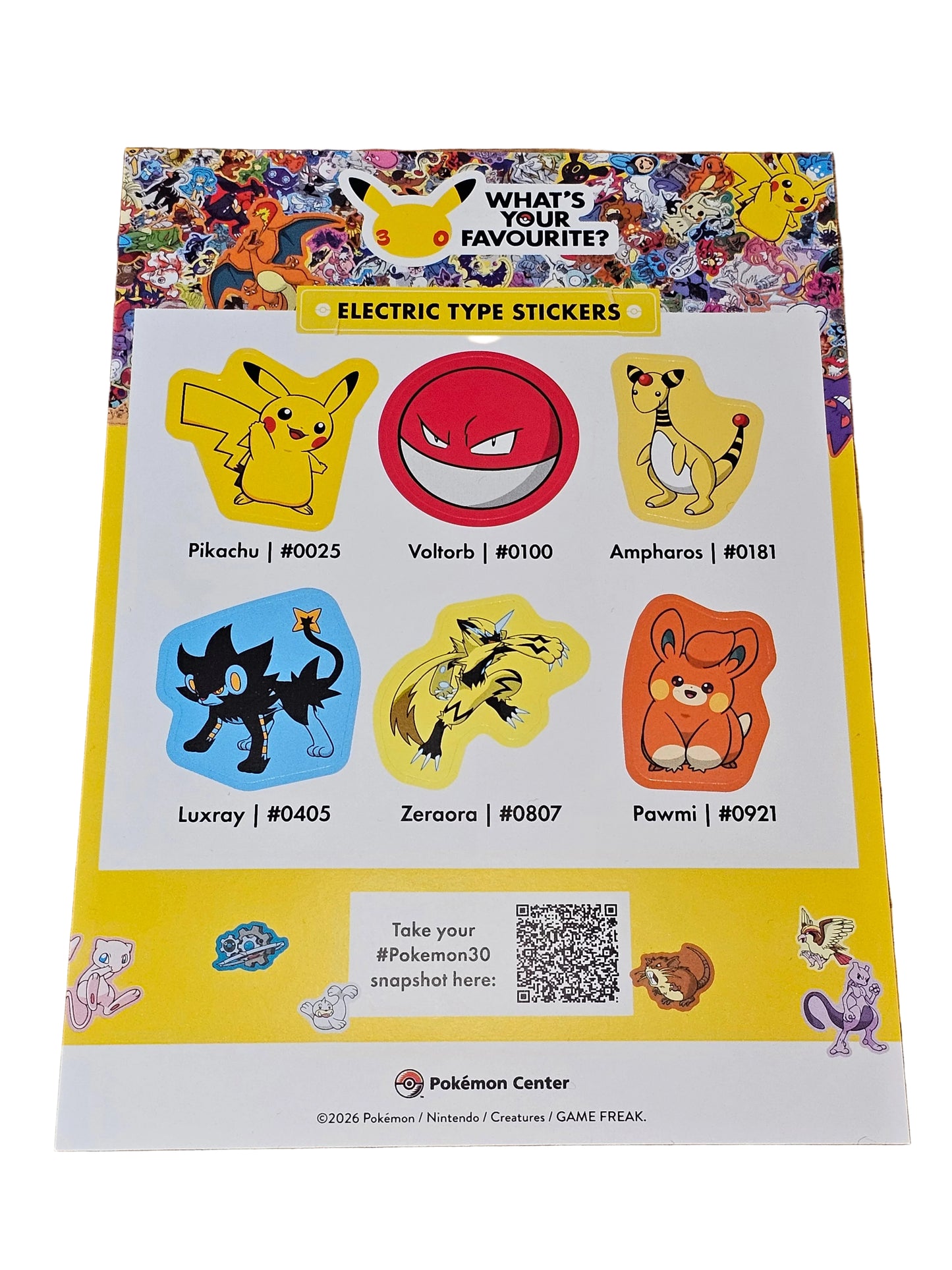 Sheet of electric type Pokémon stickers on a wooden surface