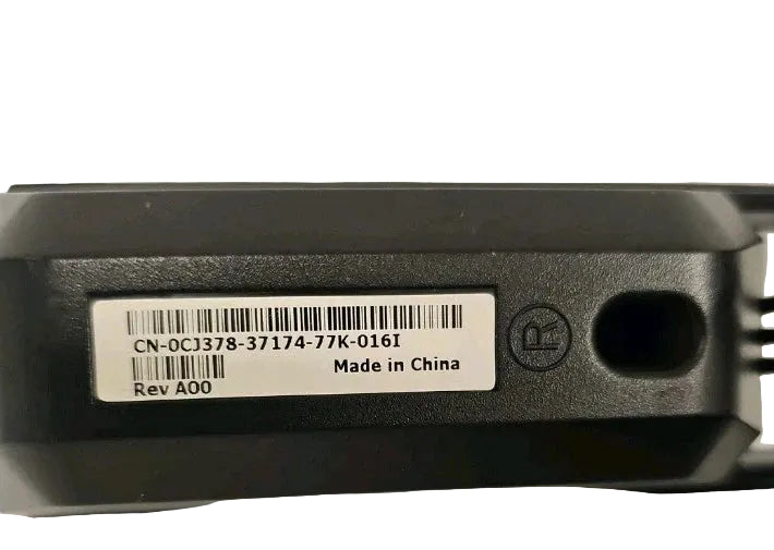 Back view of a device with a label and certification logo on a light gray background