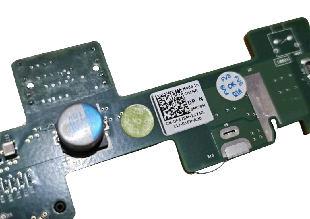 Close-up of a circuit board with a QR code label on a black background