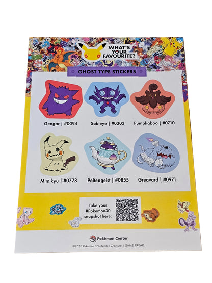 Sheet of ghost-type Pokémon stickers on a wooden surface