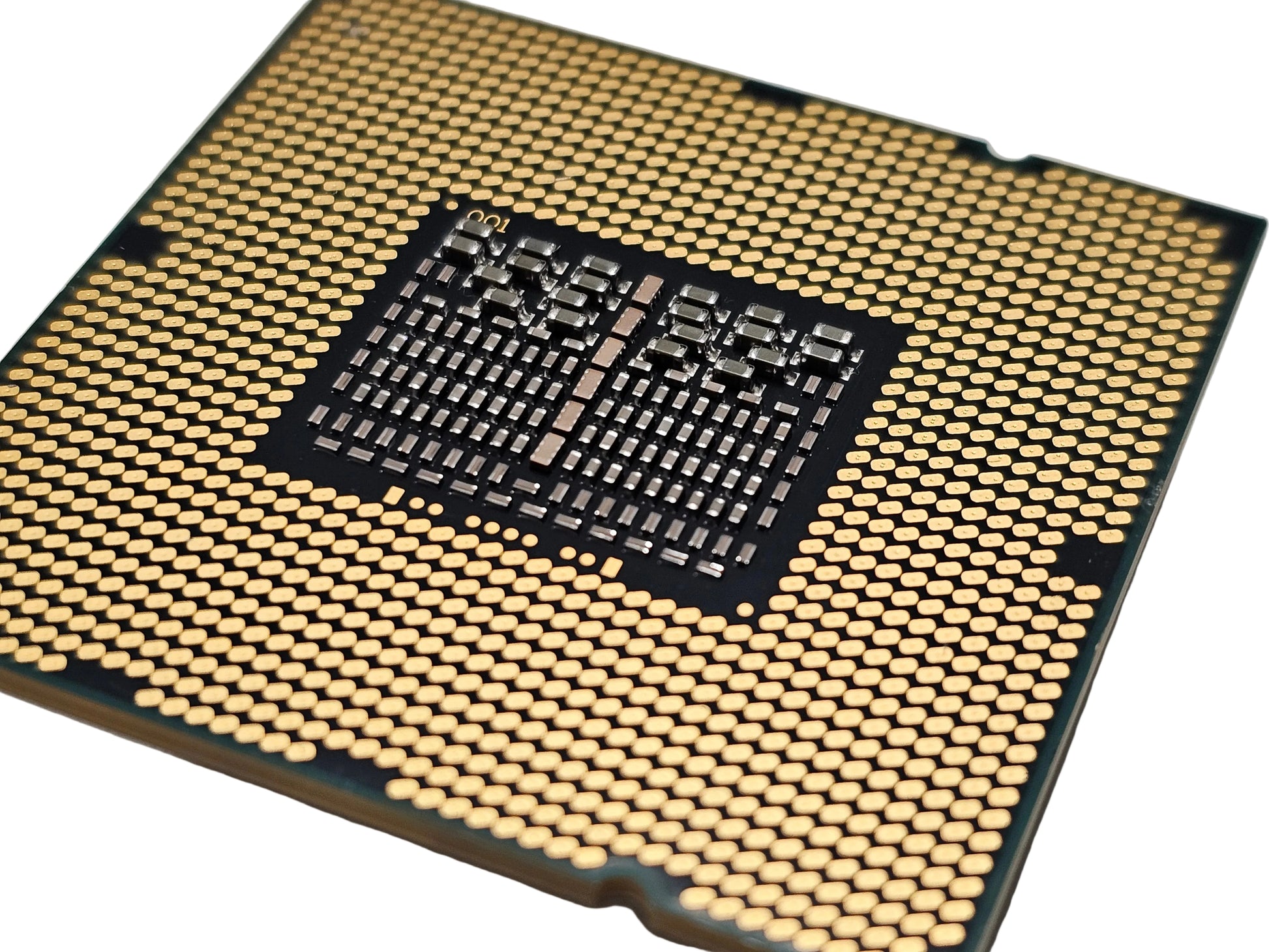 Close-up of a computer processor with a detailed layout on a gray background