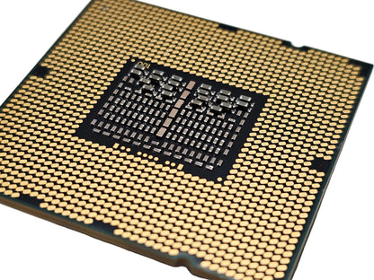 Close-up of a computer processor with a detailed layout on a gray background