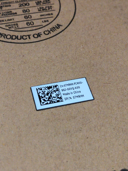 Barcode label on a cardboard surface with text indicating 'Product of China'.